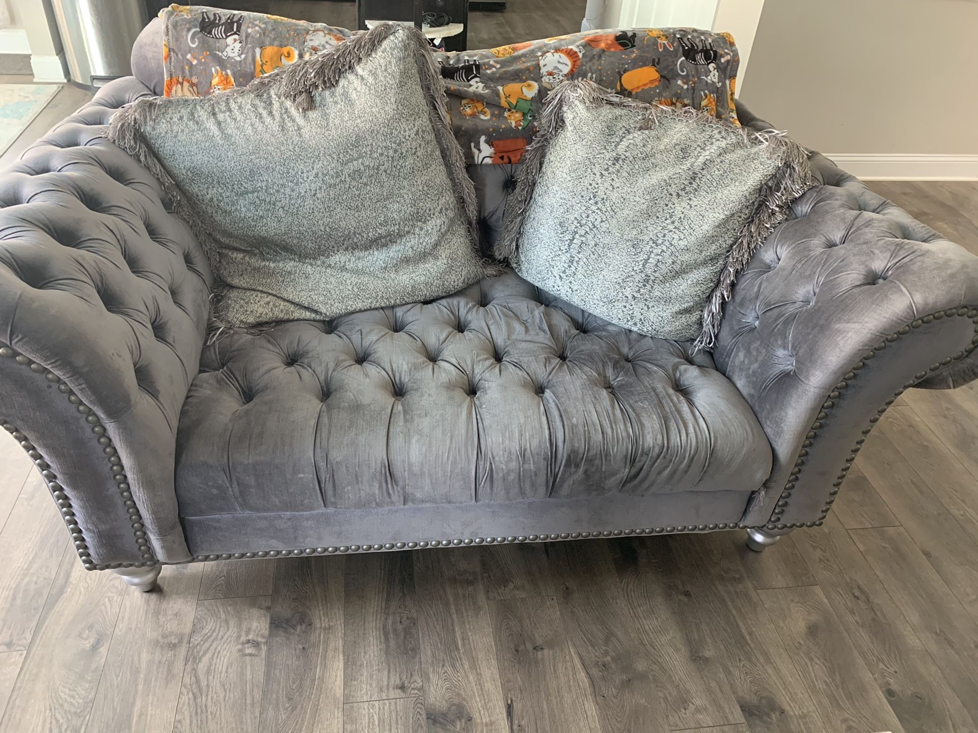 Oversized tufted couch and loveseat.