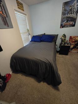 Full sized bed frame with mattress, sheets, duvet and covers. Instructions included