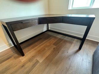 Walnut corner desk with drawers and foldout keyboard storage
