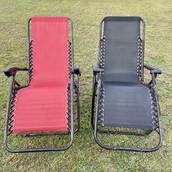 Two Zero Gravity Reclining Lounge Chairs