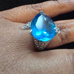 Bright blue teardrop crystal set in a sterling silver marcasite  ring. Sparkling  stone. Simple elegant cocktail style. Size 6