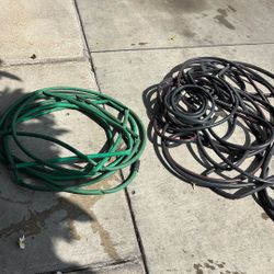 Water Hoses $5 Each (1x 50 Foot Green And & 1 X 100 Ft Grey)