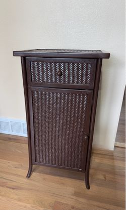 Brown rattan storage cabinet