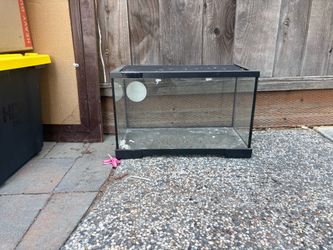 Black cage with cover that slides open and closed with lock latch