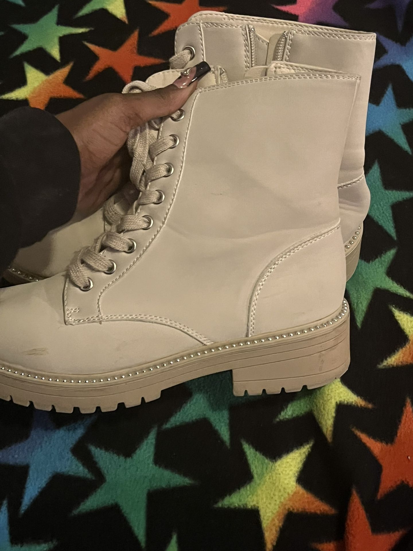 beige boots with silver embellishments