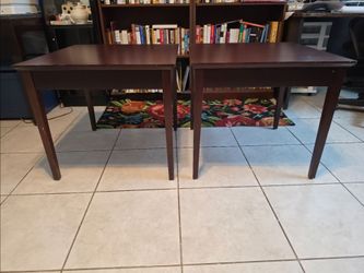 3 dark wood tables