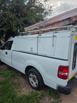 White Work Truck with Utility Topper and Rack