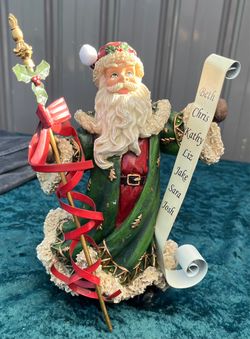 Resin Santa Claus Figurine With List Scroll.