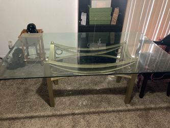 Heavy modern /Contemporary Glass dining table with Sculptural curved metal pedest.