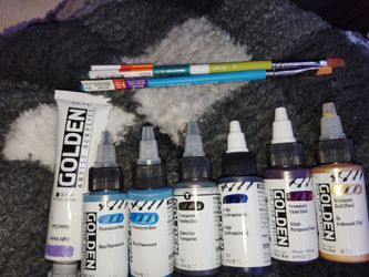 Golden paints and couple brushes