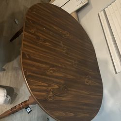 Gray sectional for a living room with a dining room table