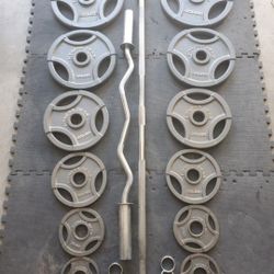..Complete Olympic Weight Set With Olympic Bar & Curl bar ..295lbs all together read Description below