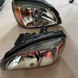 Headlights - LH/RH Cadillac - New