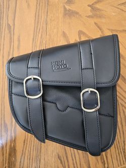 The Kemi Moto Black Synthetic Leather Motorcycle Saddlebag is a stylish and durable accessory designed specifically for motorcycles