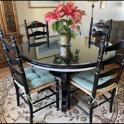 Round table with glass top and 4 chairs