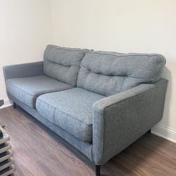 Gray Couch Normal Wear. 