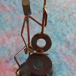 Metal scrap art figurine  sculpture of a cellist