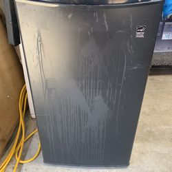 Small black refrigerator in good condition everything