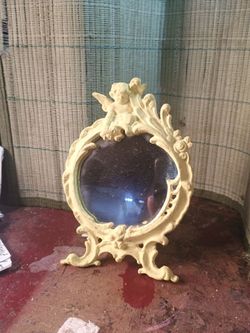 Vintage ornate tabletop mirror. Cherub accent Rococo style