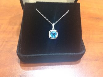 Diamond & blue topaz pendant in 14kt white gold