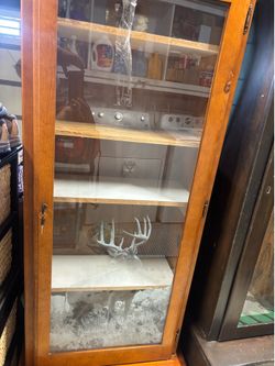 Gun and ammo glass cabinet with keys