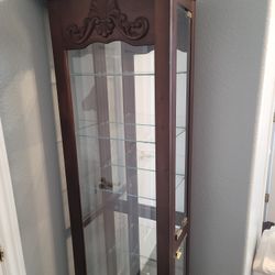 Curio cabinet with glass shelves
