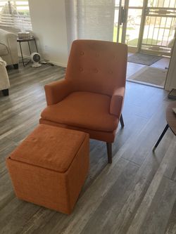 orange chair and footstool with storage compartment