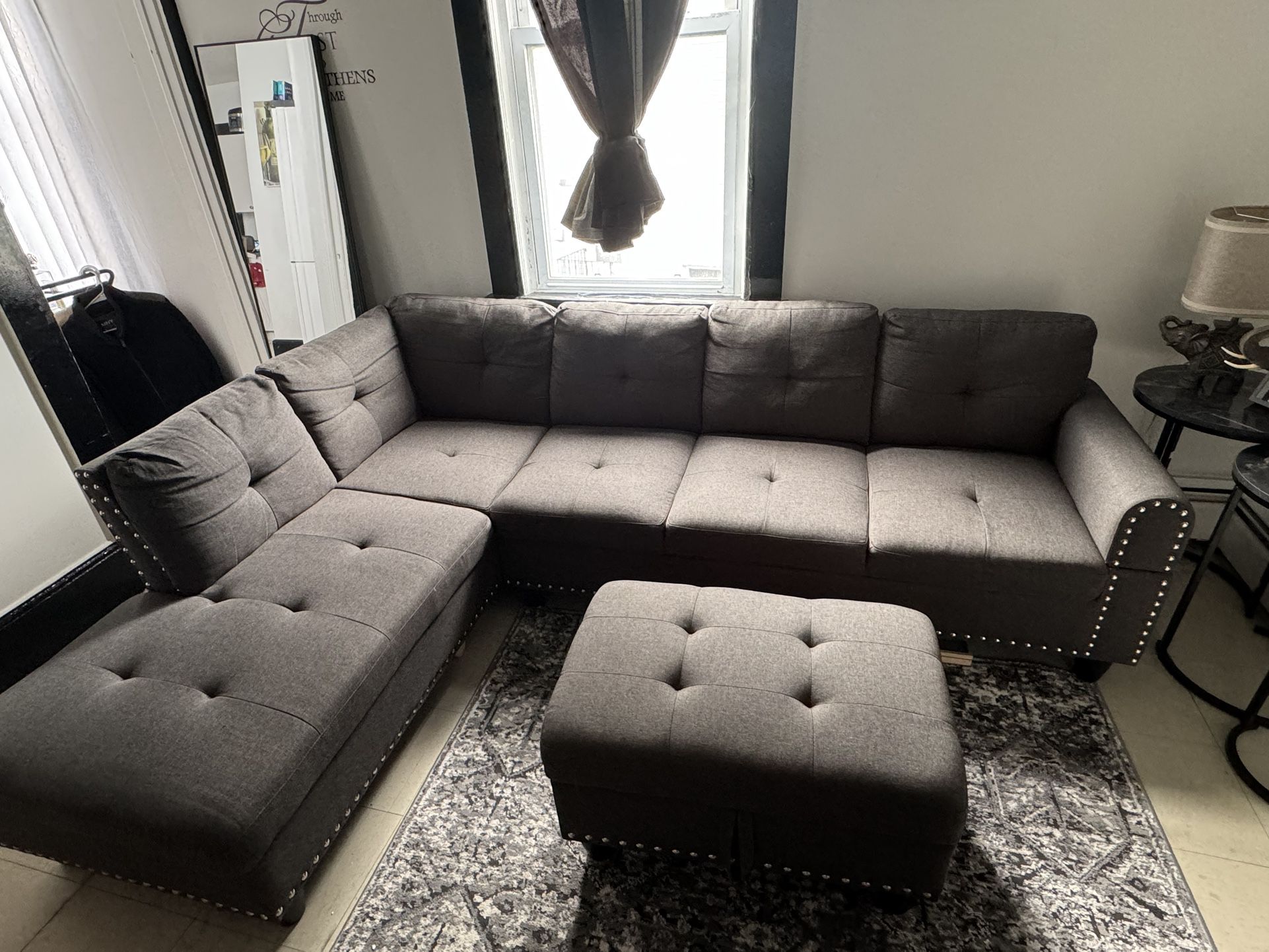 grey two piece sectional with ottoman 