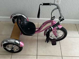 Schwinn tricycle for girls. Look the price new Good condition