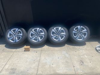 Set 16” Honda factory steel wheel w hub caps 5x4.5 w 205/60/16 tires, good condition, sell  all $220.00