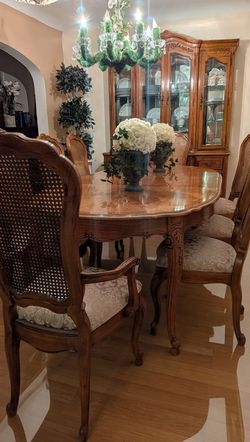 Beautiful oval solid wood, dining table and eight chairs