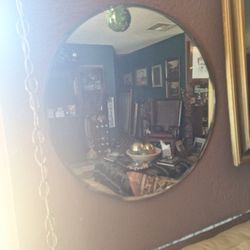 Antique round mirror.