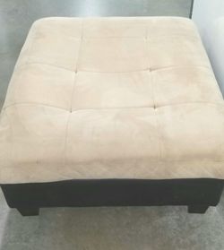 Suede ottoman with leather trim