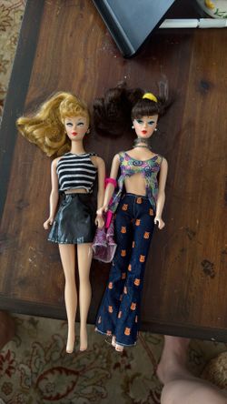 2 Barbie dolls, one from 1994 and the other from her 35th anniversary.