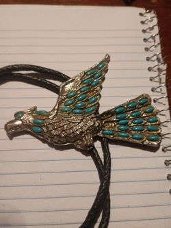 Used silver-toned FLYING 🦅 EAGLE BOLO TIE WITH TURQUOISE PIECES FOR SALE.