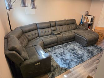 Grey electric recliner with phone chargers