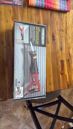 Reciprocating saw with rotating handle