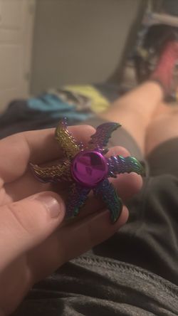 Flames style fidget spinner with iridescent colors Flames style fidget spinner