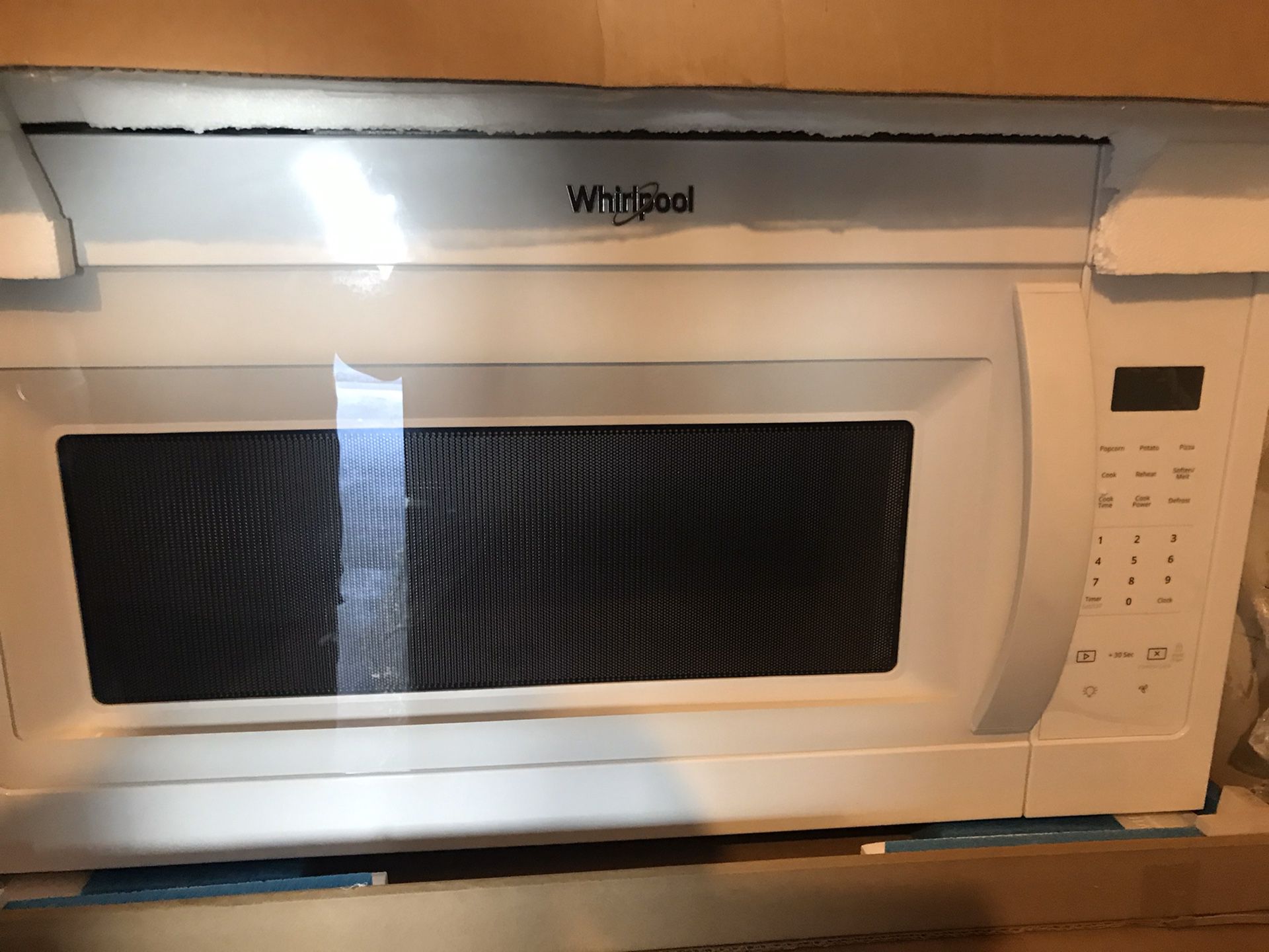 New Whirlpool microwave with the fan / over the range microwave