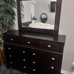 Dresser With Mirror, Dresser and Fake Plant
