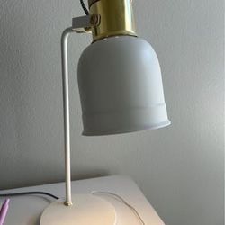 Elegant white and gold Desk Lamp with built in USB charging.