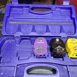 Set of three guitar effects pedals with case