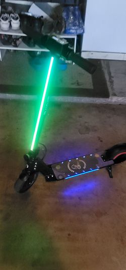 Kids scooter new condition goes 15 mph , led lighs firm price