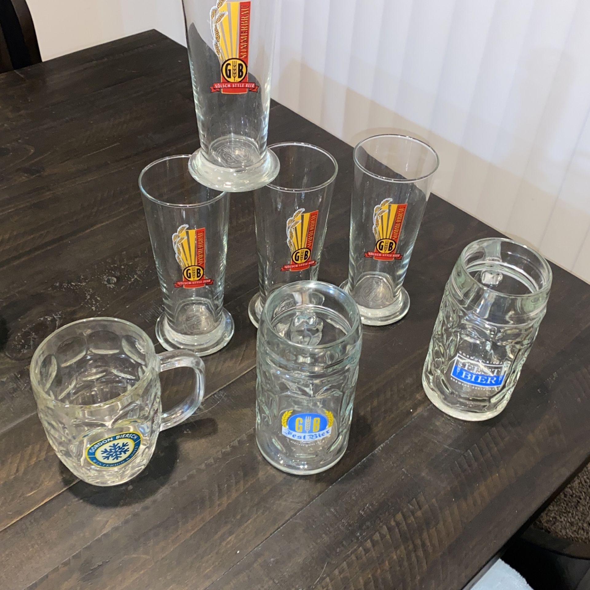 Collection of Gordon Biersch beer mugs and beer glasses