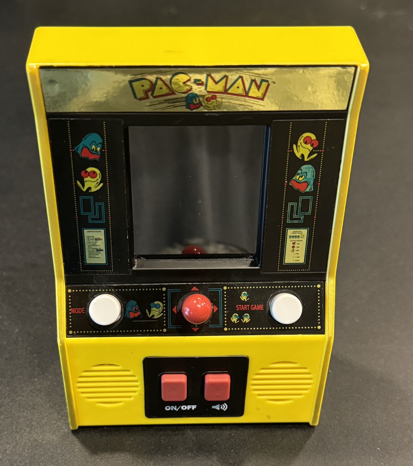 Pac-Man Color Arcade Classics LCD Retro Mini Arcade Game, Yellow- Tested. Clean battery compartment. Requires 3 AA batteries not included.