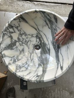 White and gray Carrera marble vessel sink