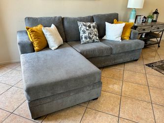 DELIVERY AVAILABLE Gorgeous Grey Sectional couch with reversible chaise from Living Spaces
