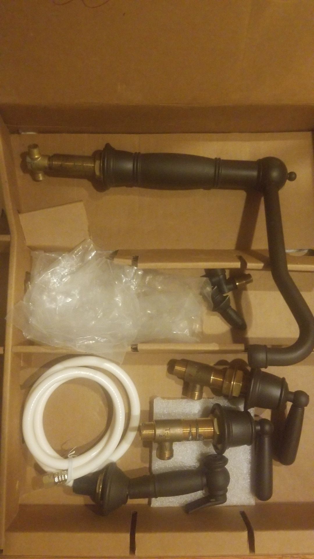 Bronze kitchen faucet with spray. Brand new