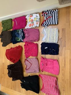 Pile of xl clothes, shirts and sweatshirts