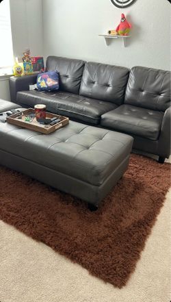Dark Leather Sectional Sofa with Ottoman